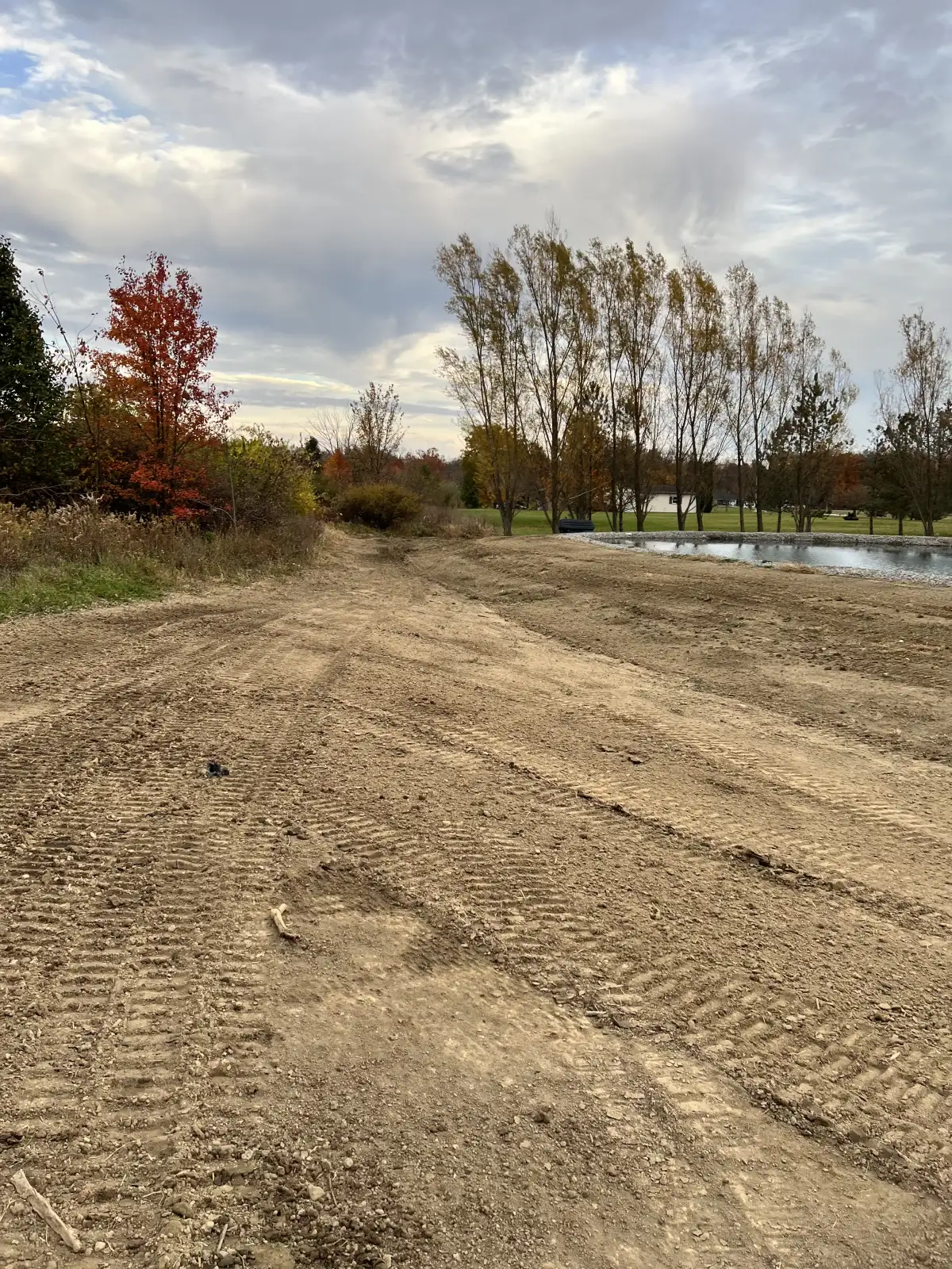 Completed grading and seeding project showing fresh topsoil and seed at an Ohio property