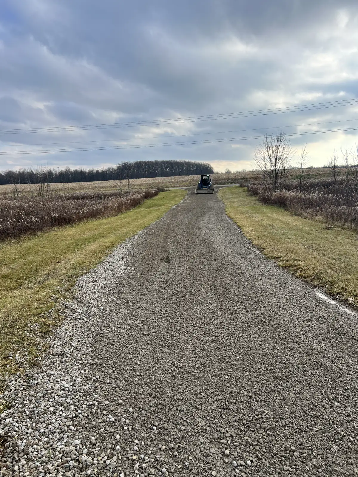 New gravel driveway installation at a rural property in Central Ohio