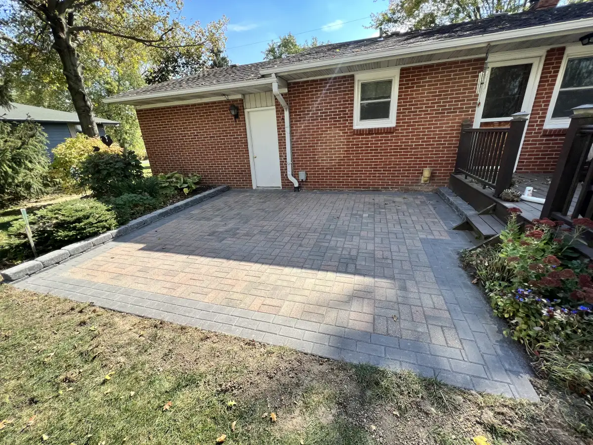 Curved paver walkway leading to a front entrance in Marysville, Ohio