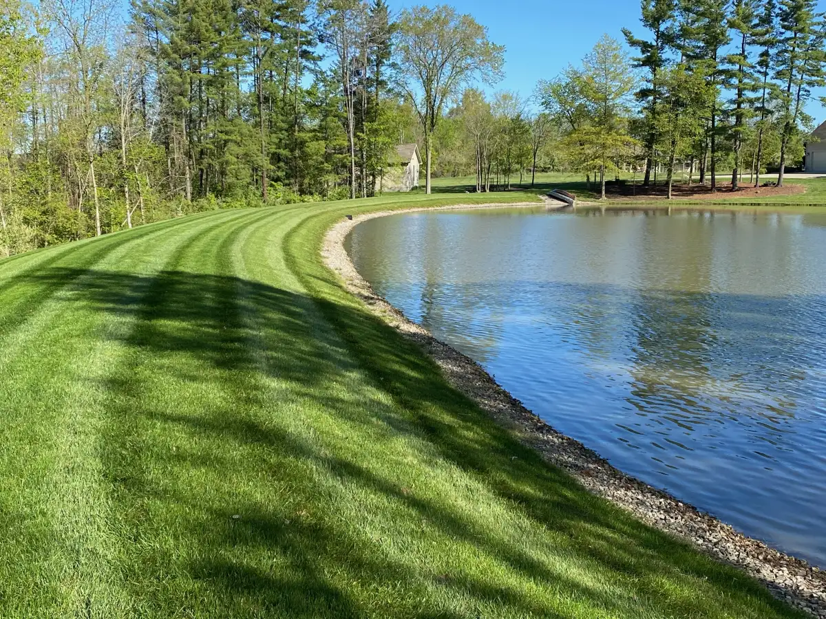 Fall leaf cleanup in progress at a Marysville residential yard with leaves being blown and collected