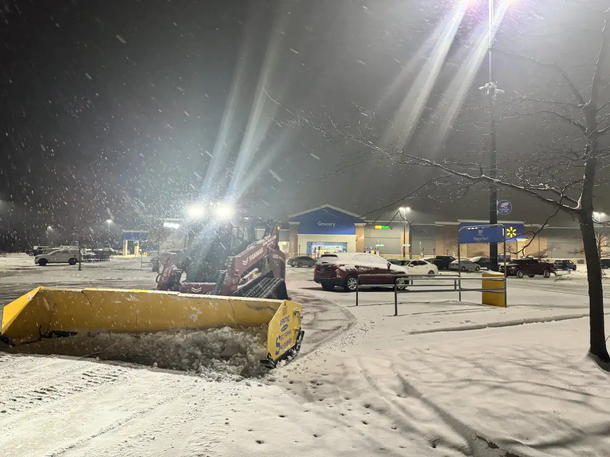 Snow plowing service in progress at a commercial property in Union County, Ohio